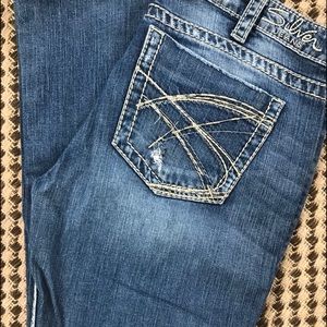Silver distressed bootcut jeans 30x33